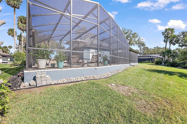 view of yard featuring a patio area and a lanai