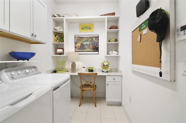 laundry area featuring separate washer and dryer and cabinets