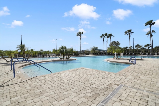 2440 Pawtucket Pass, Mount Dora, FL 32757 - community pool featuring a patio