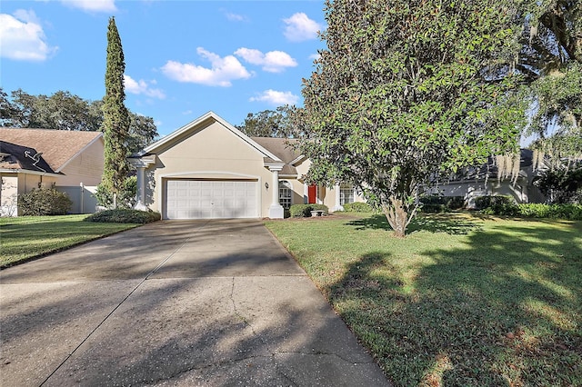 view of front facade with a front lawn and a garage