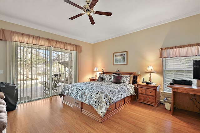 bedroom featuring access to exterior, light wood-type flooring, ceiling fan, and ornamental molding