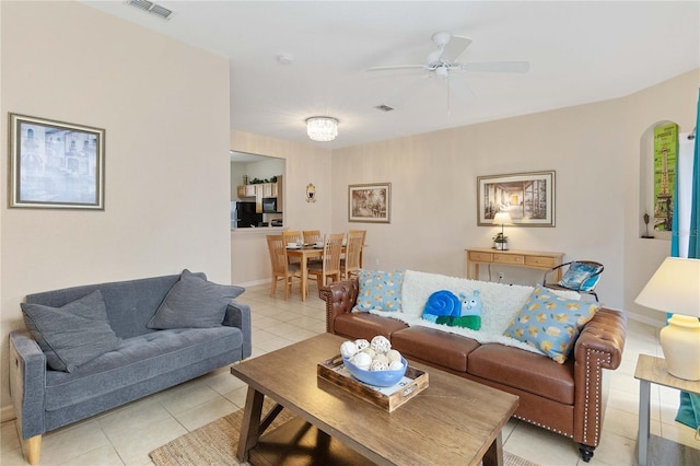 tiled living room featuring ceiling fan