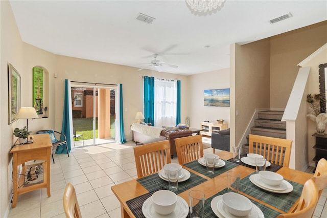 dining area featuring ceiling fan and light tile patterned flooring