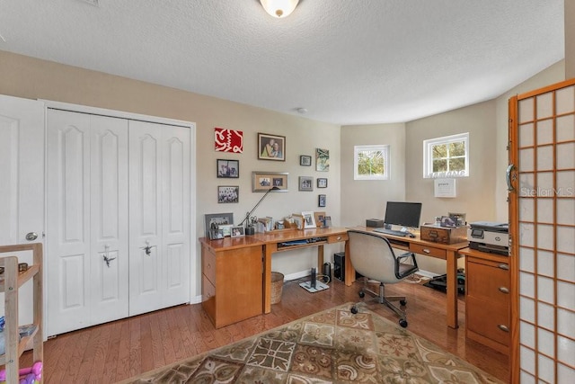 office with a textured ceiling and hardwood / wood-style flooring