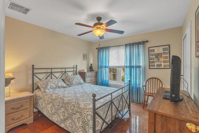 bedroom featuring ceiling fan and dark hardwood / wood-style floors