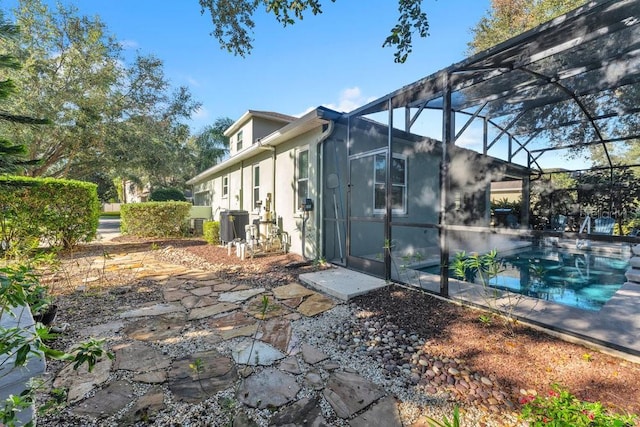 view of side of property with a lanai