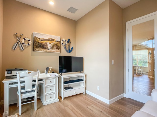 home office with light wood-type flooring