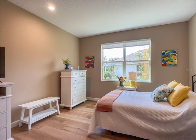 bedroom with light hardwood / wood-style flooring