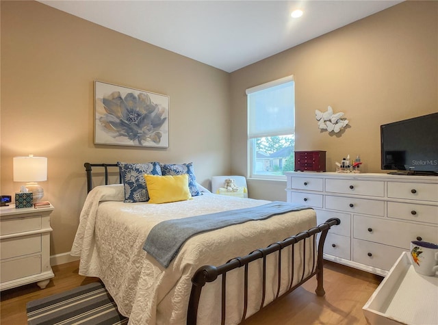 bedroom with wood-type flooring