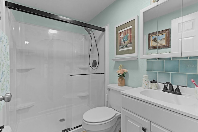 bathroom featuring decorative backsplash, vanity, toilet, and an enclosed shower