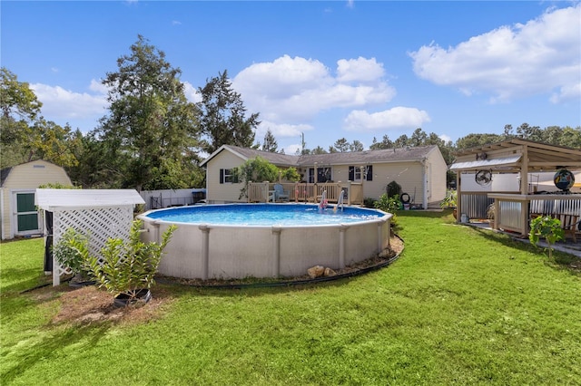 view of swimming pool featuring a yard