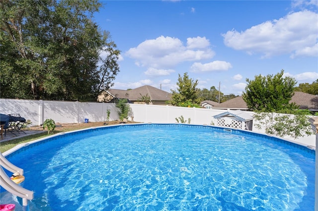 view of pool featuring a water slide