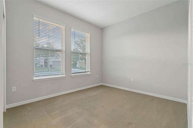 empty room featuring light colored carpet