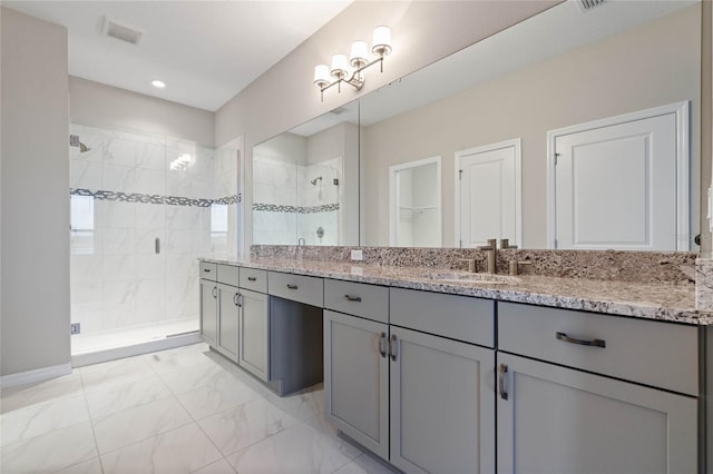 bathroom with vanity and an enclosed shower