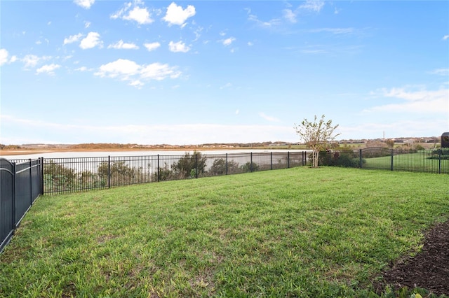 view of yard with a rural view