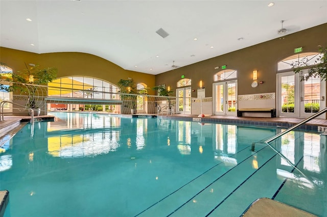 view of swimming pool featuring french doors