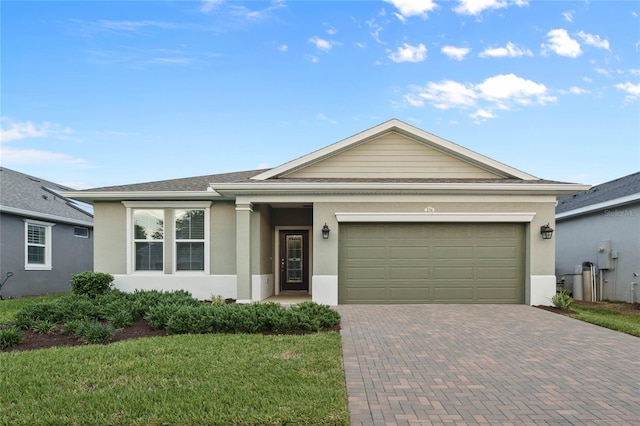 ranch-style home with a front lawn and a garage