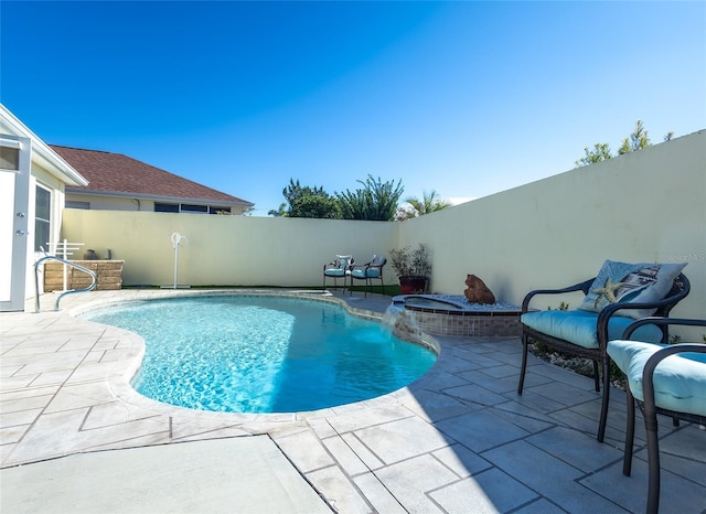 view of pool with a patio and a hot tub