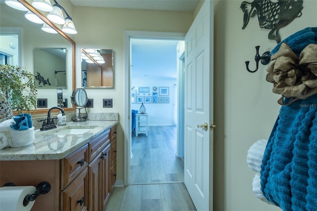 bathroom featuring hardwood / wood-style floors and vanity