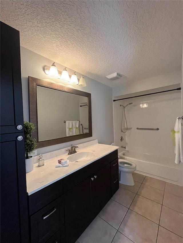 full bathroom with vanity, shower / bath combination, tile patterned floors, and a textured ceiling