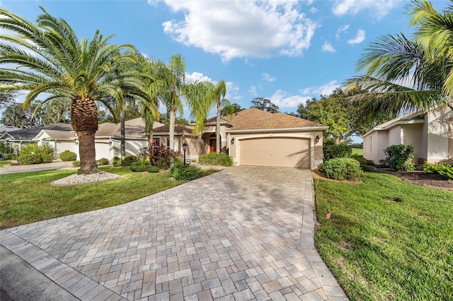 view of front of property with a garage and a front yard