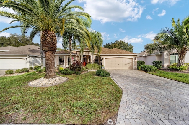 view of front facade with a front yard and a garage