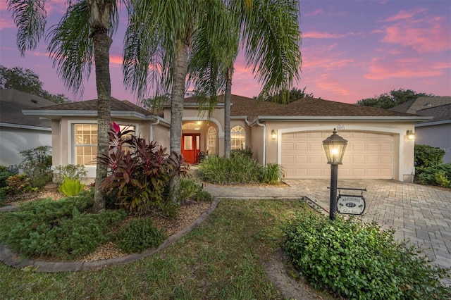 view of front of property with a garage