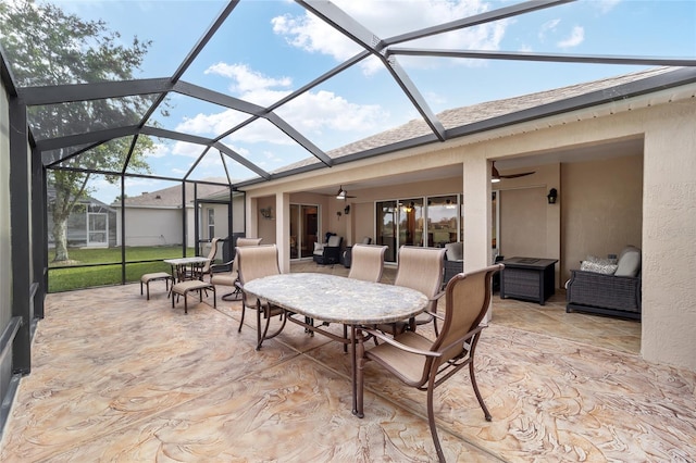 view of patio / terrace with glass enclosure and ceiling fan