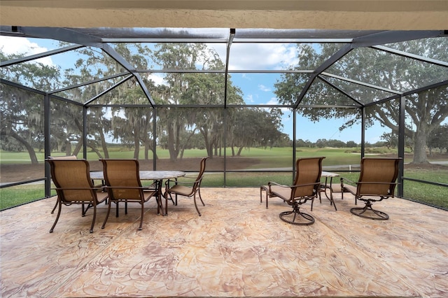 view of patio / terrace featuring a lanai