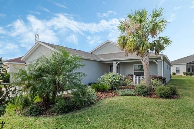 view of front of house with a porch and a front lawn