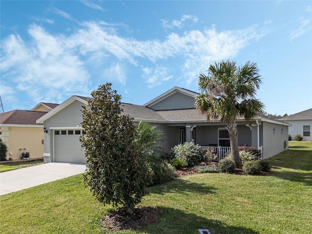 single story home with covered porch, a garage, and a front yard