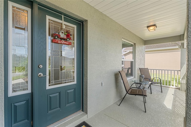 property entrance featuring covered porch