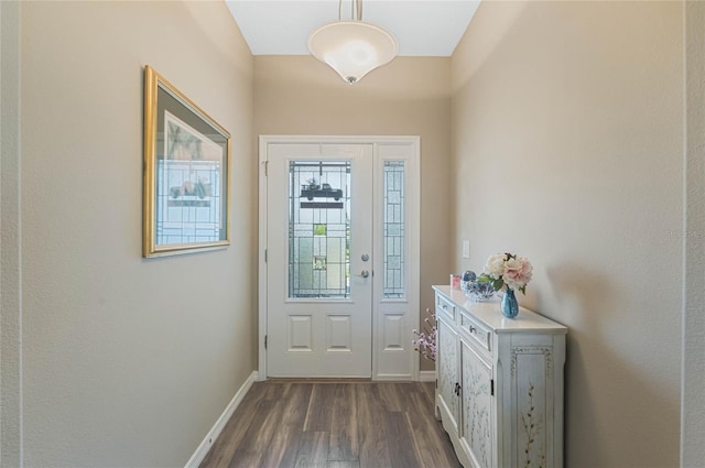 doorway to outside with dark wood-type flooring