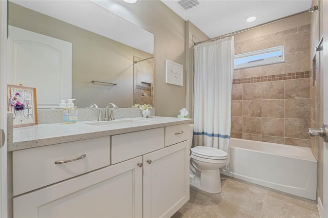 full bathroom with shower / tub combo with curtain, vanity, and toilet