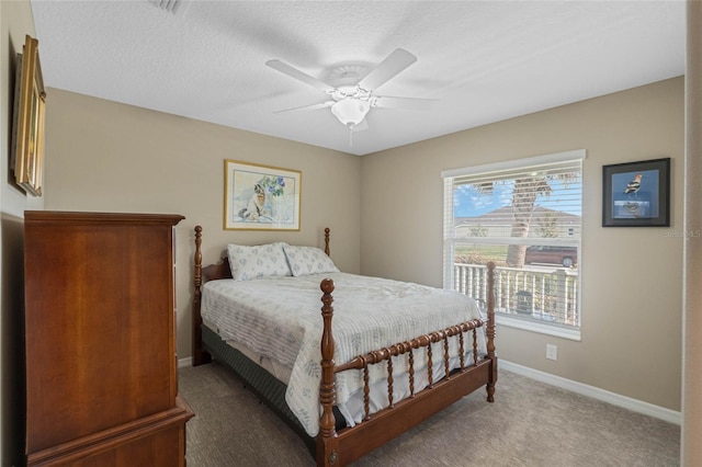 bedroom with carpet, a textured ceiling, and ceiling fan