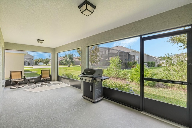 unfurnished sunroom with plenty of natural light