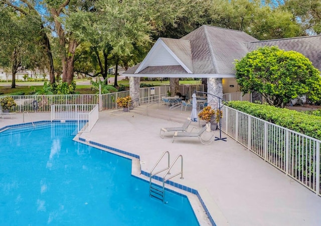 view of swimming pool featuring a patio area