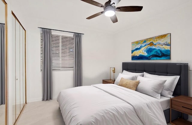 carpeted bedroom with ceiling fan