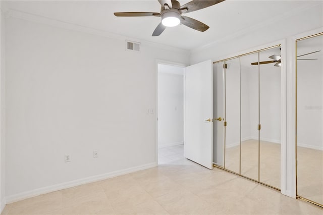 unfurnished bedroom featuring ceiling fan and crown molding