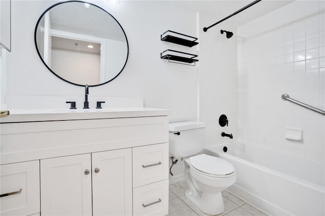 full bathroom with tile patterned floors, tiled shower / bath combo, toilet, and vanity