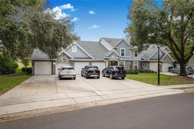 view of front of home featuring a front lawn and a garage