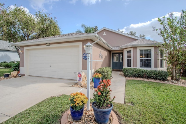 ranch-style home with a garage and a front yard