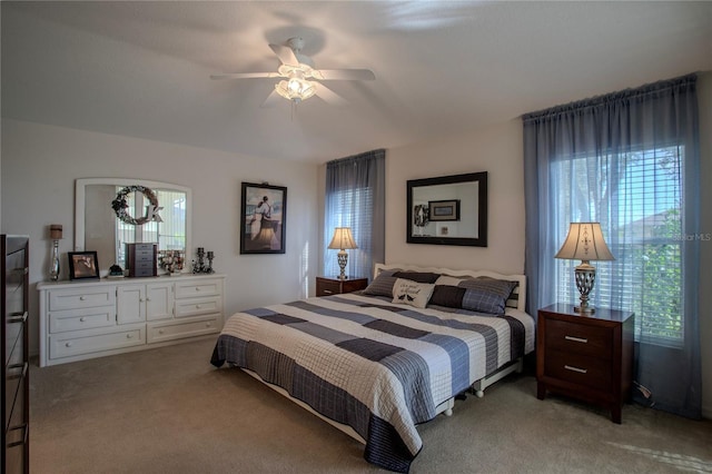 bedroom featuring ceiling fan and light colored carpet