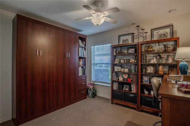 home office with carpet flooring and ceiling fan