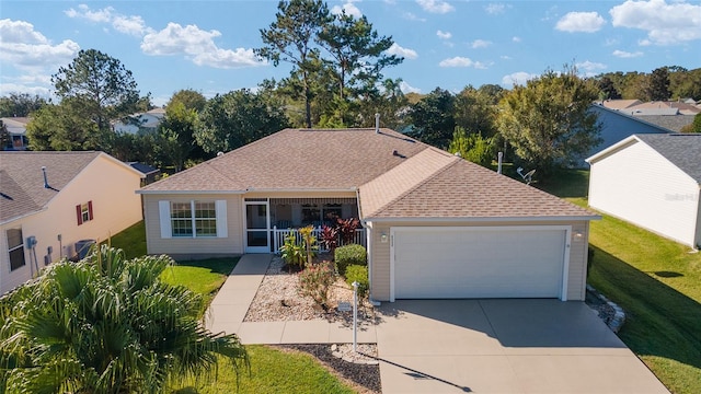 single story home with covered porch, a front yard, and a garage