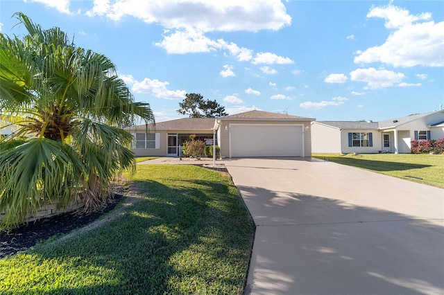 ranch-style home featuring a garage and a front lawn