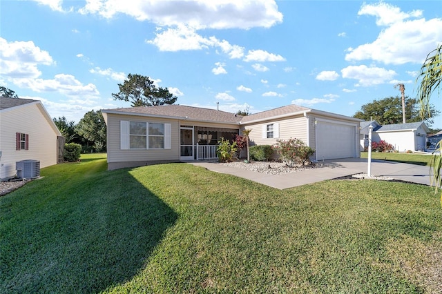 ranch-style home featuring a front yard, central AC unit, and a garage