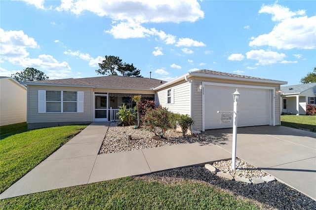 ranch-style home featuring a garage and a front yard