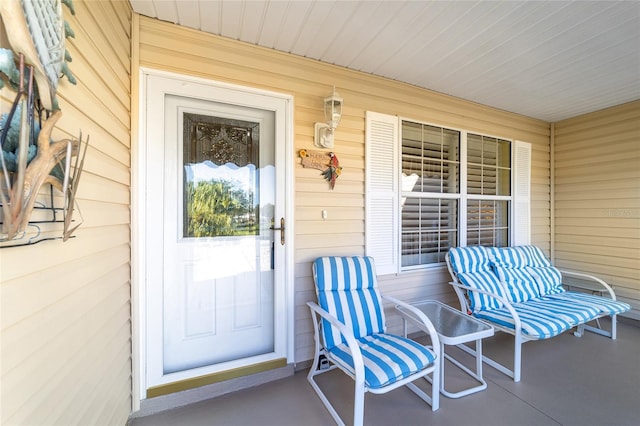 doorway to property featuring covered porch