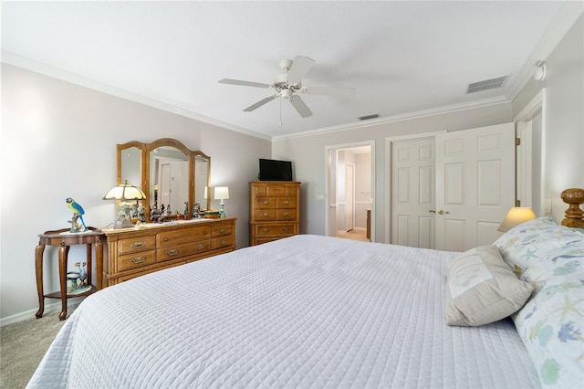 bedroom featuring ceiling fan, carpet floors, ornamental molding, and a closet